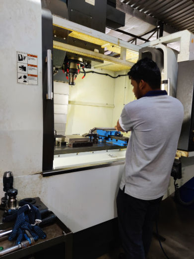 Operator at a vertical machining centre on the SGK shop floor